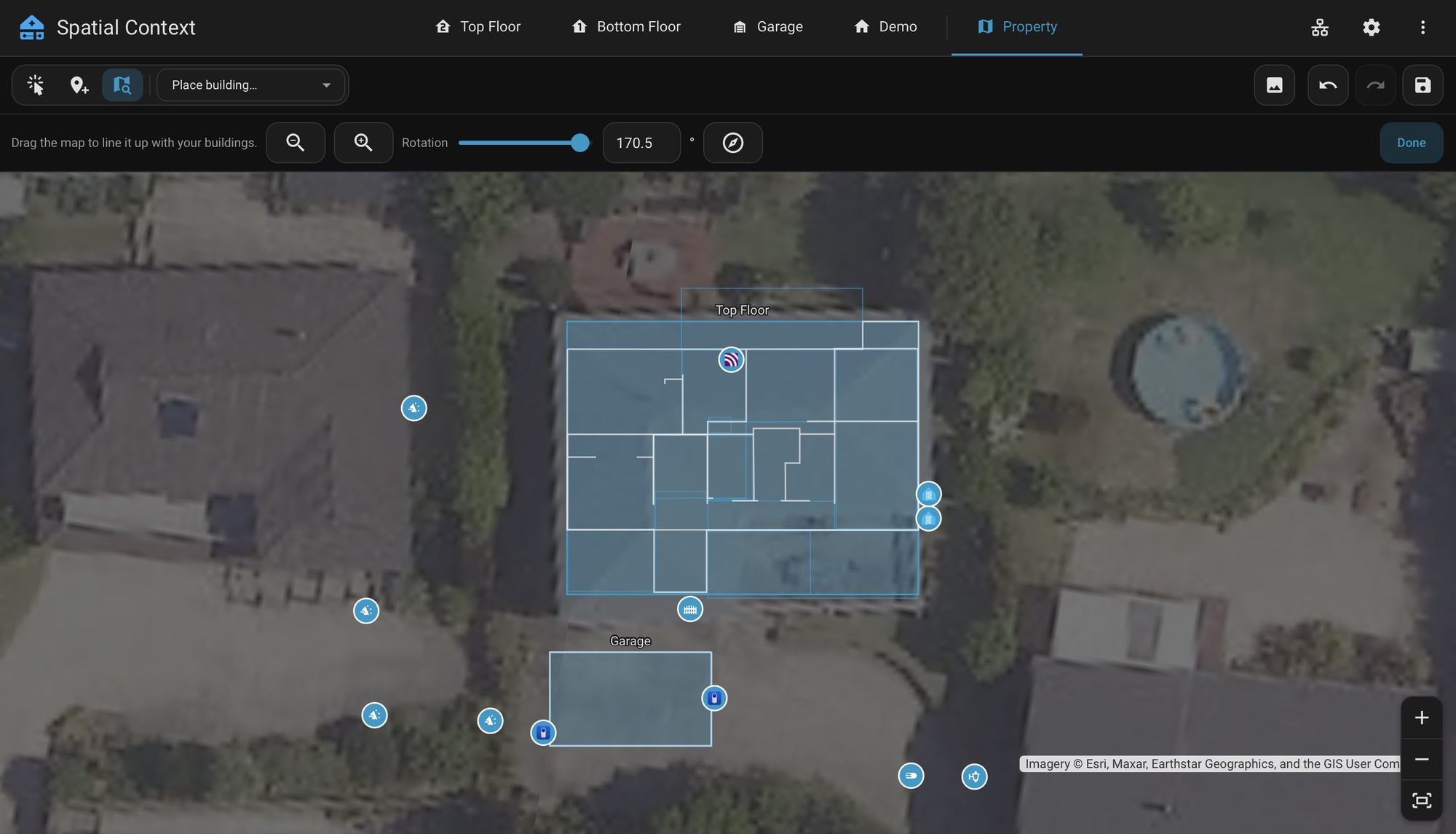 The Property tab on an aerial map in Move Map mode: the buildings stay put, and the third bar holds the zoom controls, the rotation slider and Done